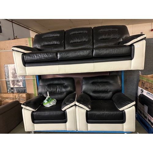 3328 - A white and black faux leather upholstered three seater sofa and two armchairs