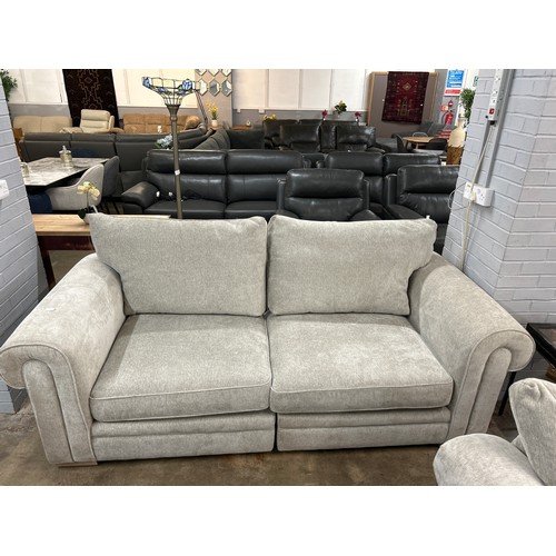 3191 - A beige upholstered three seater sofa and a love seat