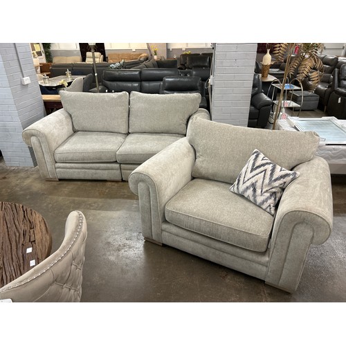 3191 - A beige upholstered three seater sofa and a love seat