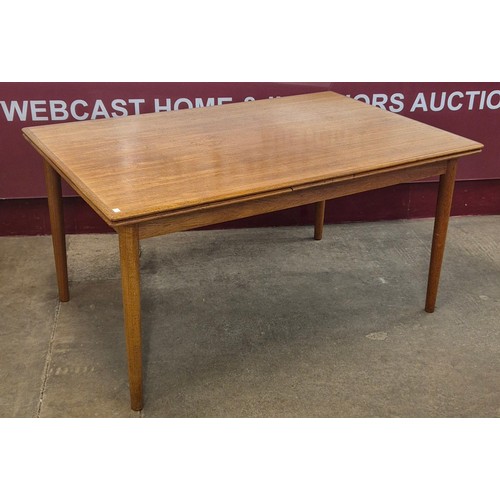 9 - A large Danish teak rectangular extending dining table