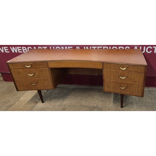 11 - A Meredew afromosia concave desk