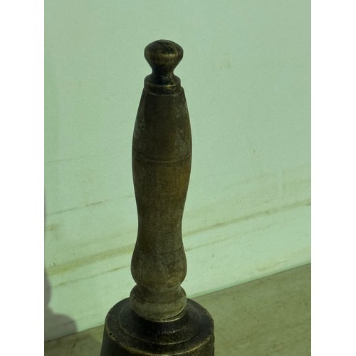 5114 - A cast metal hand bell with a wooden handle* This lot is subject to VAT