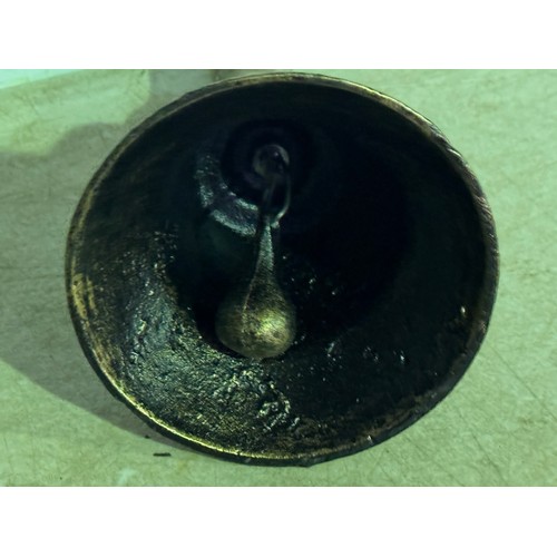 5114 - A cast metal hand bell with a wooden handle* This lot is subject to VAT