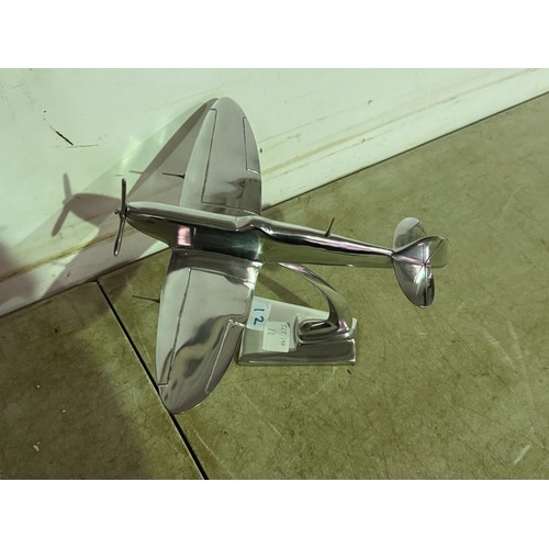 5116 - An aluminium Spitfire model plane * This lot is subject to VAT