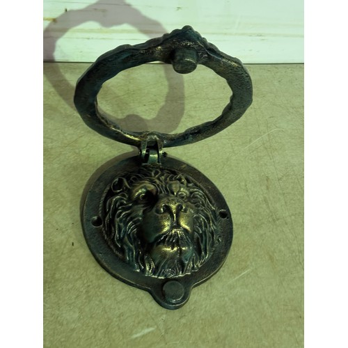 5145 - A cast metal lion head door knocker* This lot is subject to VAT