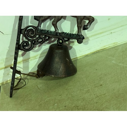 5158 - A cast metal horse bell with wall bracket* This lot is subject to VAT