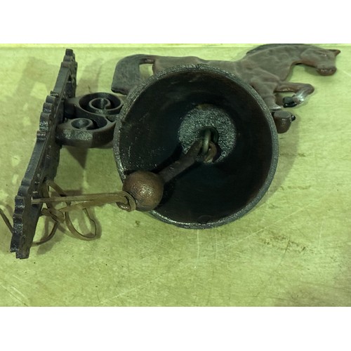 5158 - A cast metal horse bell with wall bracket* This lot is subject to VAT