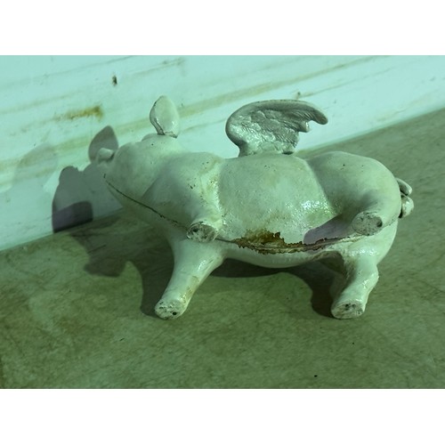 5163 - A cast metal flying pig piggy bank* This lot is subject to VAT