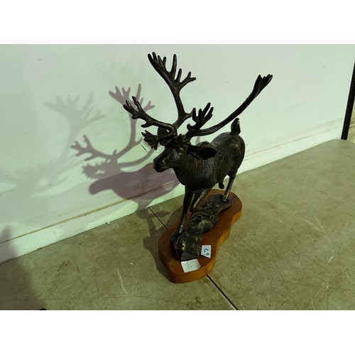 A cast metal bronze effect statue of a stag with raised leg* This lot is subject to VAT