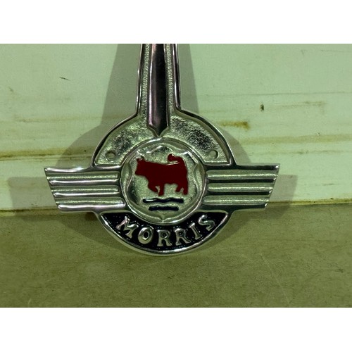 5195 - A metal Morris Bonnet logo plaque* This lot is subject to VAT