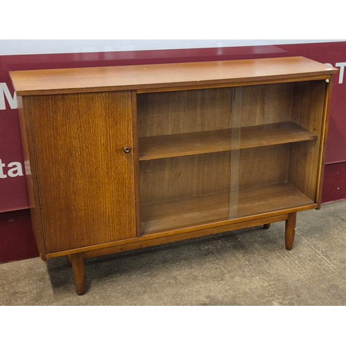 16 - A teak bookcase