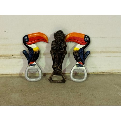 5119 - A selection of cast metal bottle opener items including skull, a parrot figure, 2 toucans and a Hob ... 