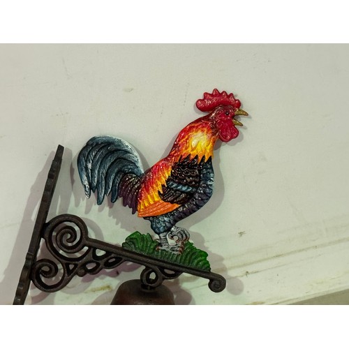 5140 - A cast metal Cockerel bell with wall bracket* This lot is subject to VAT