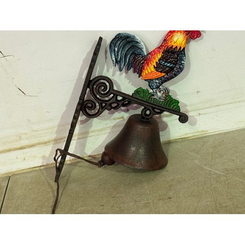 5140 - A cast metal Cockerel bell with wall bracket* This lot is subject to VAT