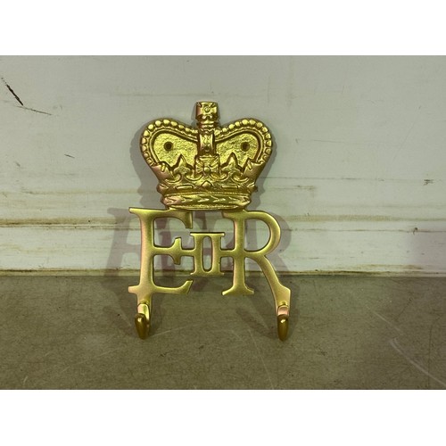 5141 - A cast metal Elizabeth II coat hook and a cast metal Ireland coat hook* This lot is subject to VAT