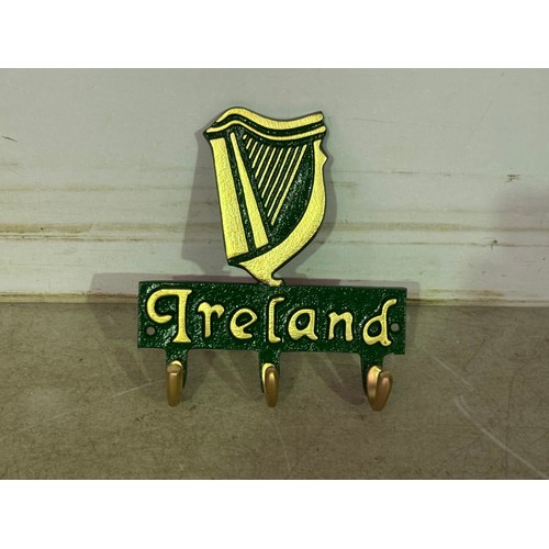 5141 - A cast metal Elizabeth II coat hook and a cast metal Ireland coat hook* This lot is subject to VAT