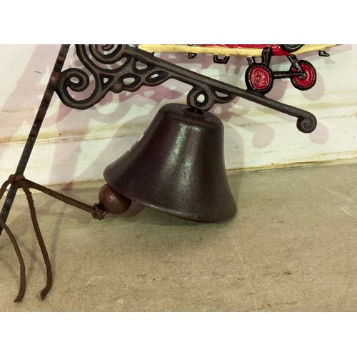 5166 - A cast metal bi-plane bell with wall bracket* This lot is subject to VAT