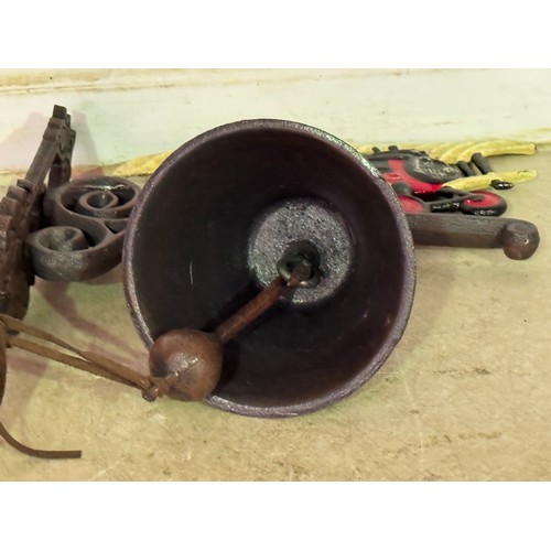 5166 - A cast metal bi-plane bell with wall bracket* This lot is subject to VAT