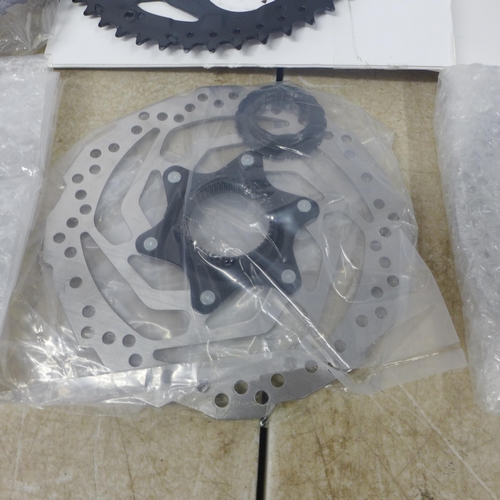 5226 - A quantity of bike parts including Shimano chain, disk brake pads