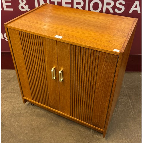 35 - A teak record cabinet