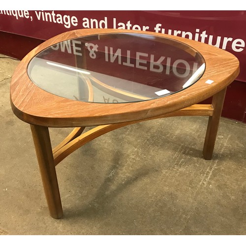 42 - A Nathan teak and glass topped triangular coffee table