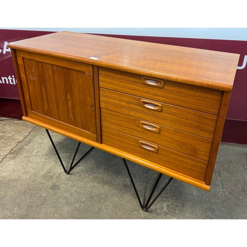 59 - A small teak sideboard, on black metal hairpin legs