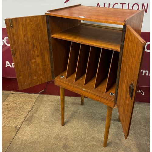 61 - A teak two door fitted record cabinet