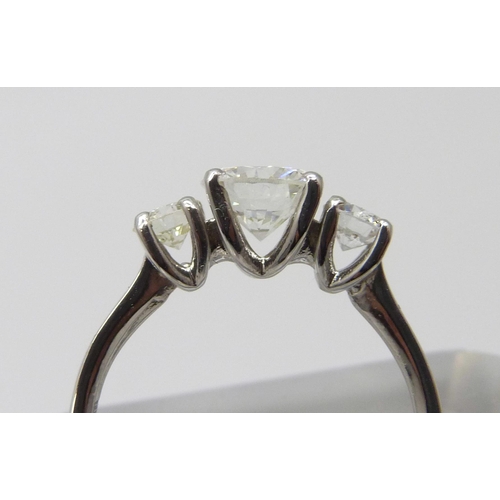 7001 - A hallmarked platinum three stone diamond ring, total diamond weight 1.40cts, centre stone 0.98ct, 3... 