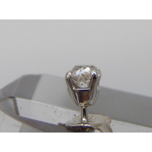 7002 - A pair of hallmarked 18ct white gold diamond stud earrings, total diamond weight 0.92cts