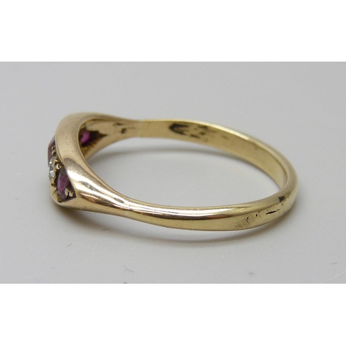 7005 - An 18ct gold, diamond and red stone ring, 3.9g, S/T