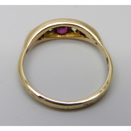 7005 - An 18ct gold, diamond and red stone ring, 3.9g, S/T