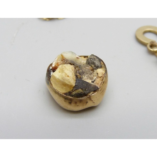 7018 - A 9ct gold chain, 2.3g, a 9ct gold bracelet, 1.7g and a yellow metal crowned tooth