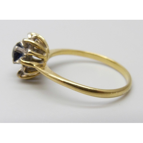 7025 - An 18ct gold, sapphire and diamond cluster ring, 3.1g, Q, hallmark worn