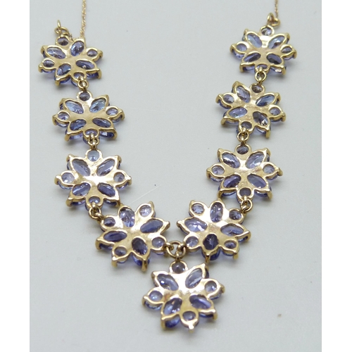 7027 - A 9ct gold and tanzanite necklace, 6.7g