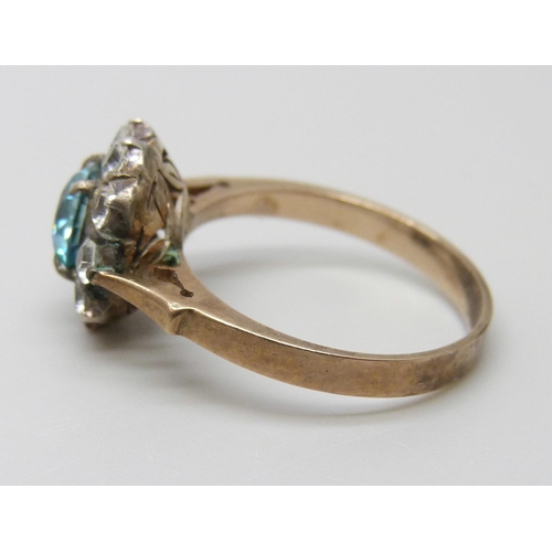 7038 - A 9k gold blue and white topaz cluster ring, 2.9g, N