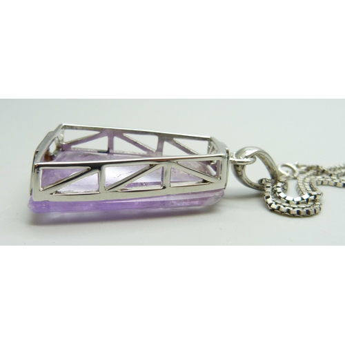 7047 - A large heavy silver set amethyst pendant on a silver chain, pendant 41mm