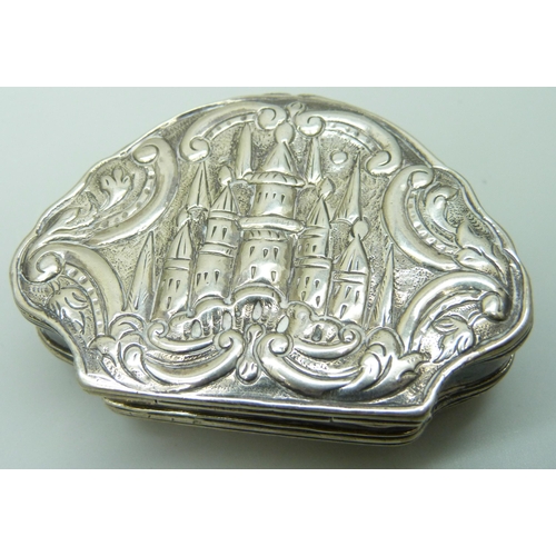 7051 - A white metal clam shell shaped box, 65mm wide