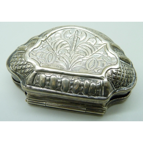 7051 - A white metal clam shell shaped box, 65mm wide