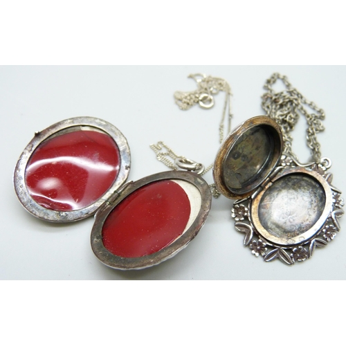 7054 - Two hallmarked silver lockets and chains