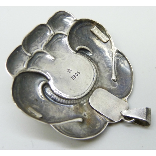 7063 - An Arts and Crafts silver pendant, M.Hammer, 5cm wide