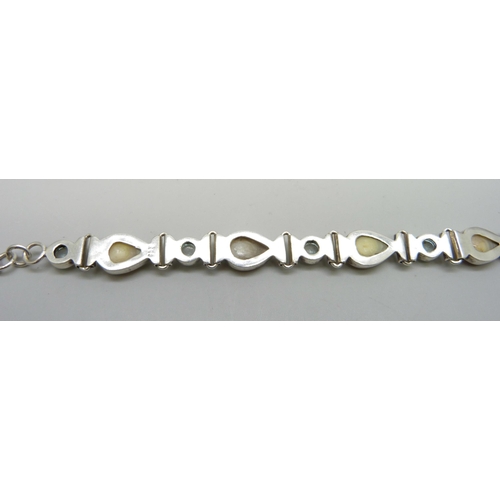 7074 - A silver mounted Arts and Crafts style mother of pearl set bracelet