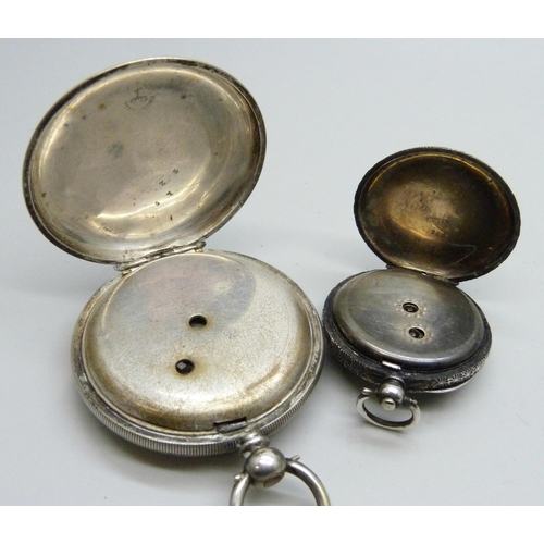 7085 - A silver pocket watch and a silver fob watch