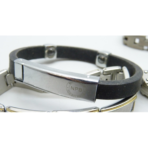 7104 - Four gentleman's stainless steel bracelets