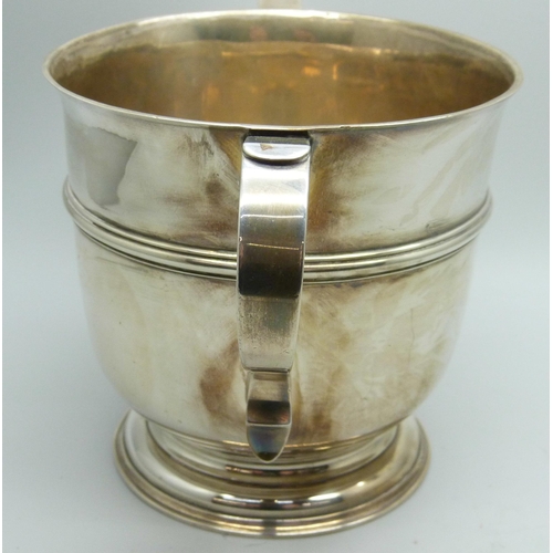 7135 - A silver two handled cup, London 1910, C.S. Harris & Sons Ltd., 346g, diameter 10.5cm