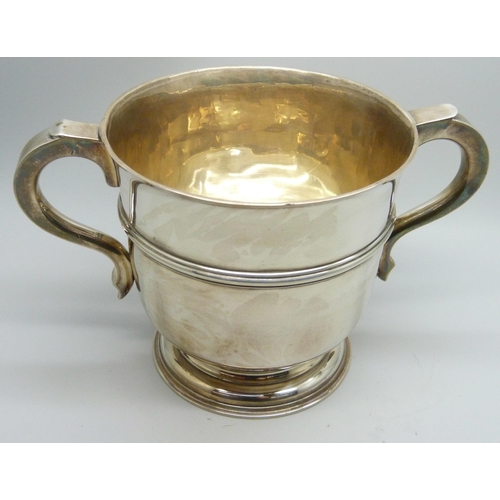 7135 - A silver two handled cup, London 1910, C.S. Harris & Sons Ltd., 346g, diameter 10.5cm