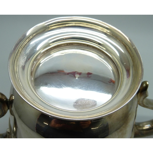 7135 - A silver two handled cup, London 1910, C.S. Harris & Sons Ltd., 346g, diameter 10.5cm