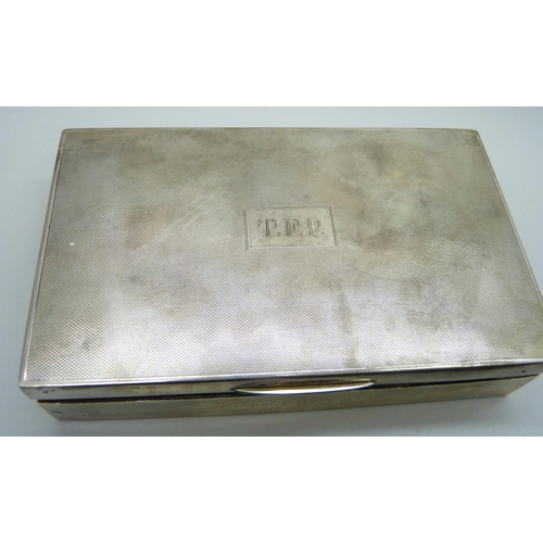 7145 - A silver cigarette box and two silver cigarette cases, (cases 174g, box 380g with liner)