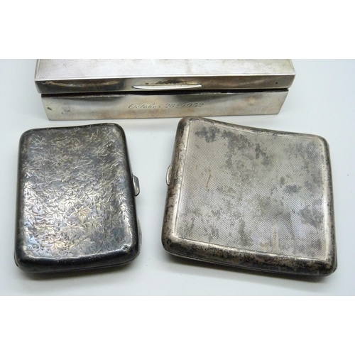 7145 - A silver cigarette box and two silver cigarette cases, (cases 174g, box 380g with liner)