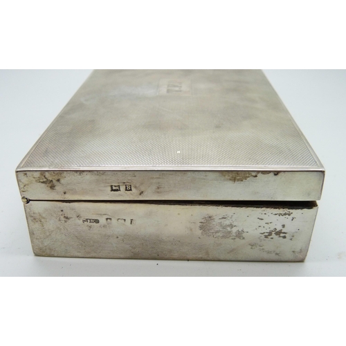 7145 - A silver cigarette box and two silver cigarette cases, (cases 174g, box 380g with liner)