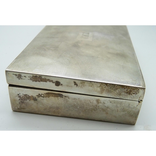 7145 - A silver cigarette box and two silver cigarette cases, (cases 174g, box 380g with liner)